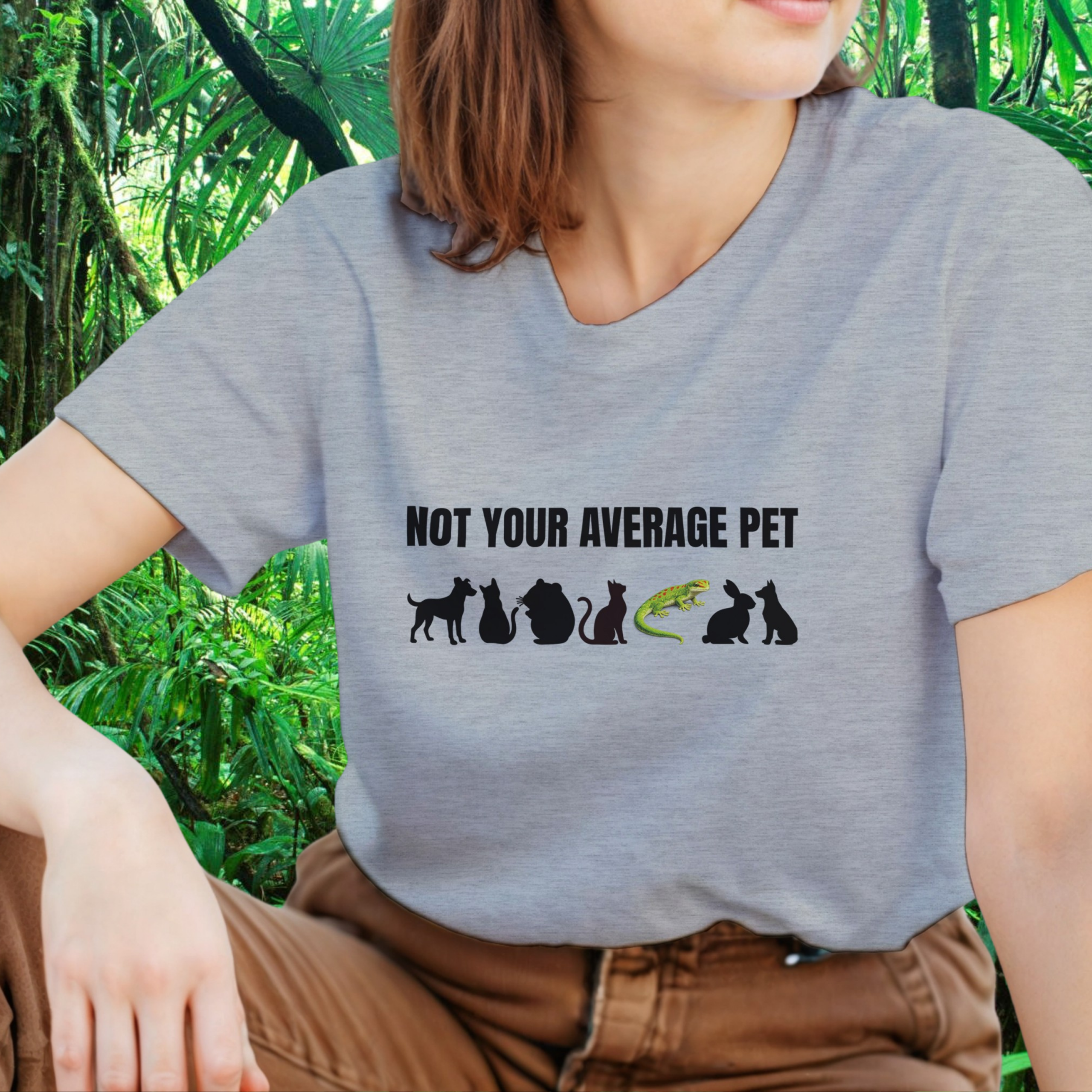 Woman wearing an ash Not Your Average Pet Gecko shirt