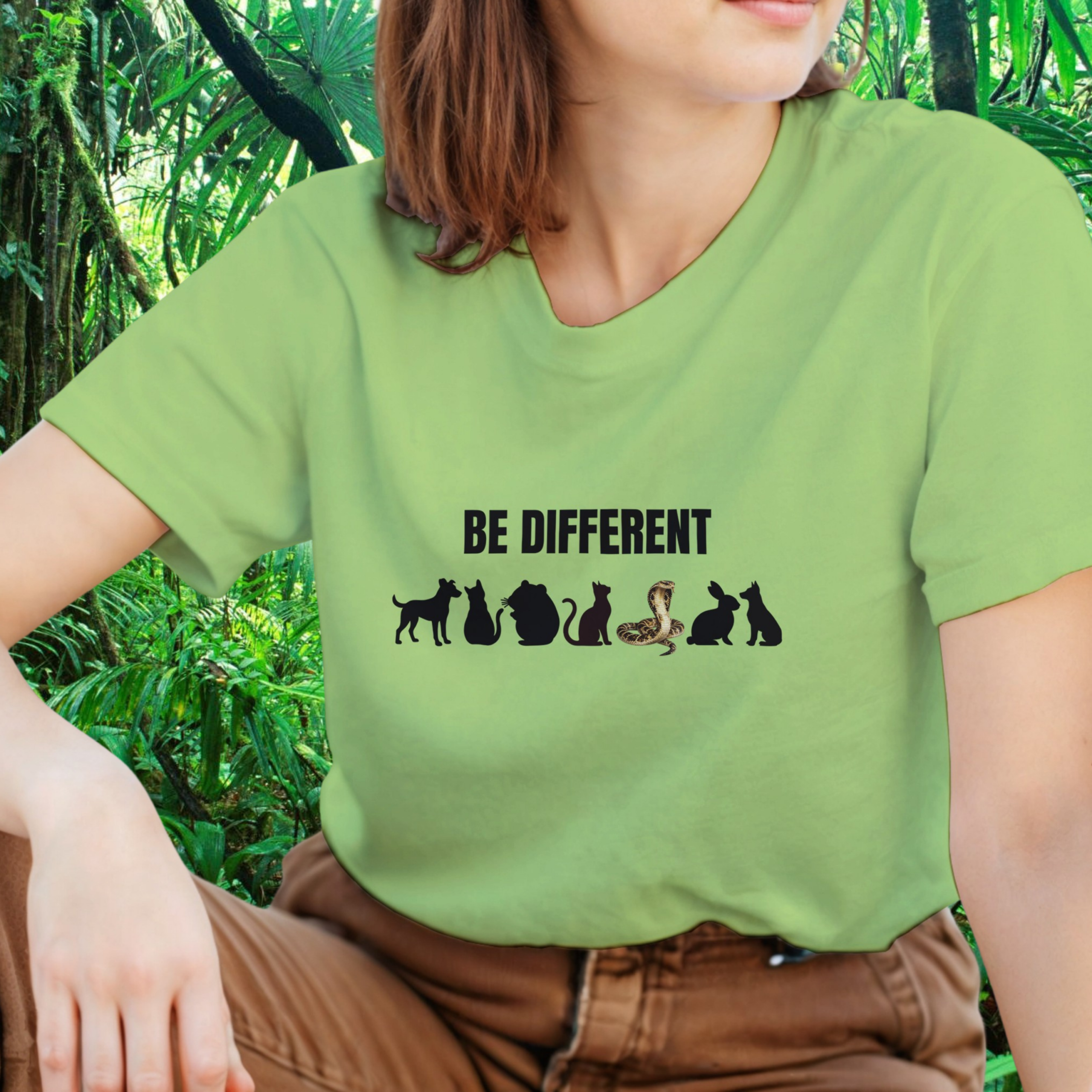 Woman wearing a kiwi Be Different Snake shirt