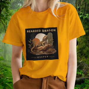 Keeper Collection – Bearded Dragon Shirt – Gold – Woman Woman wearing a gold Bearded Dragon shirt from the Keeper Collection
