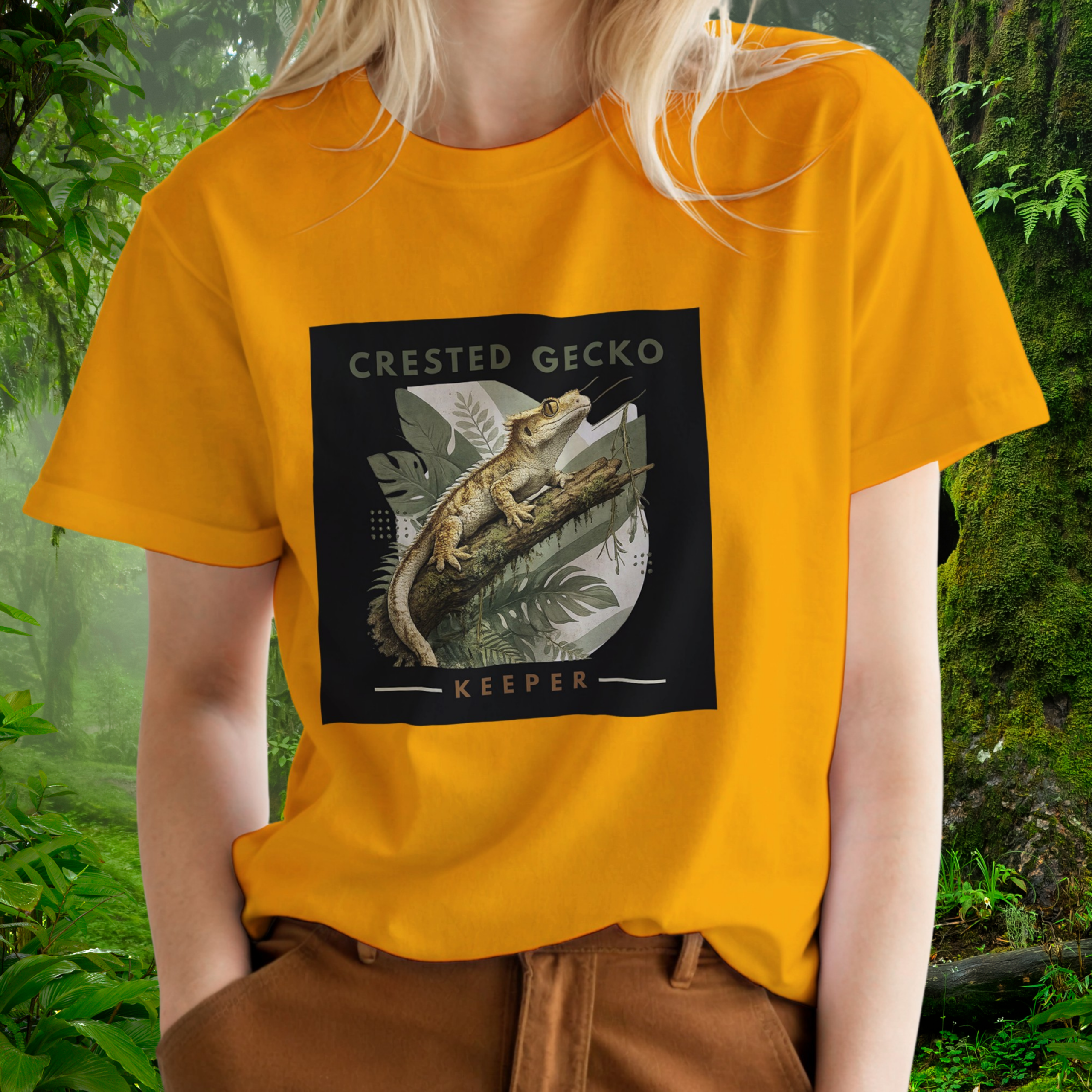 Woman wearing a gold Crested Gecko shirt from the Keeper Collection