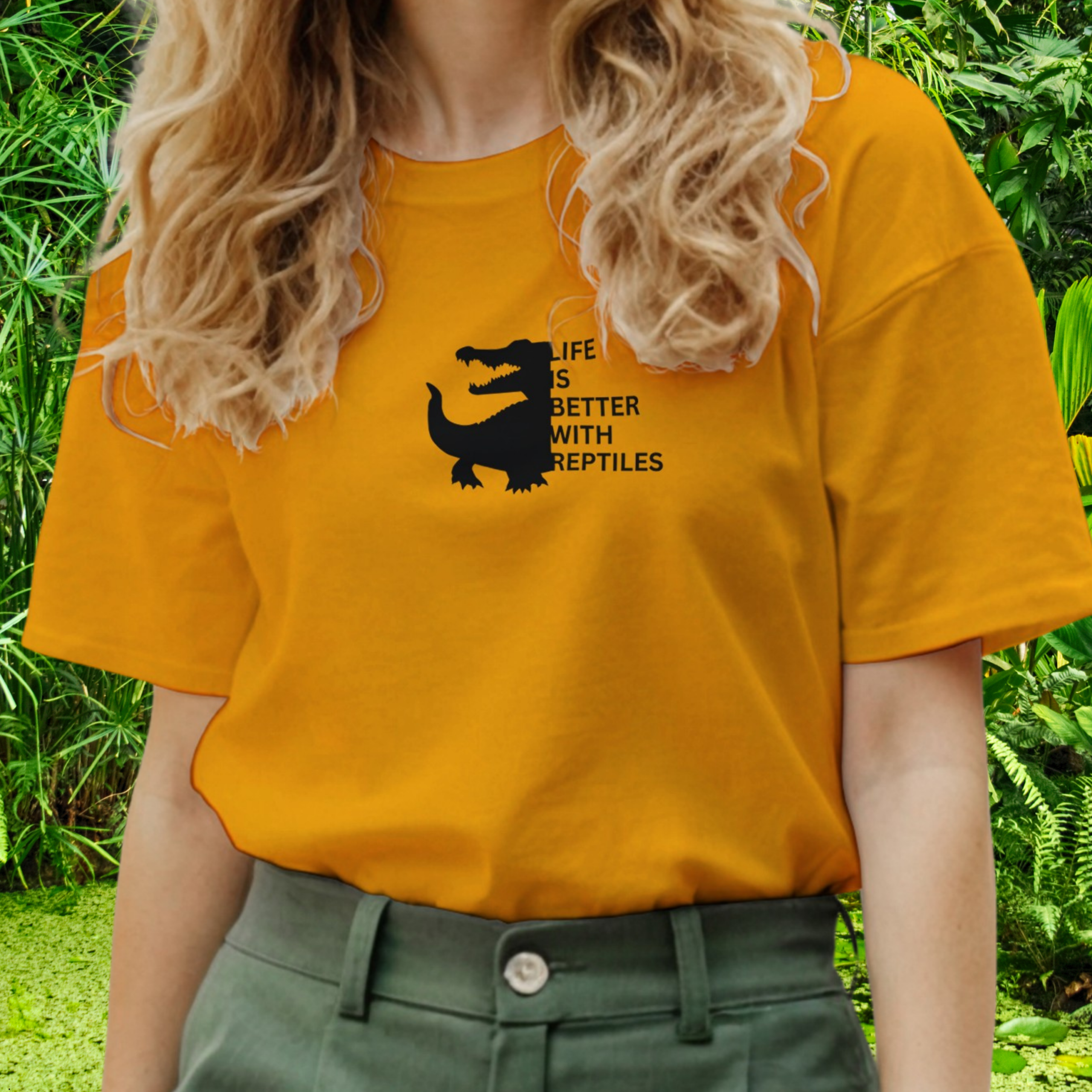 Woman wearing a gold Reptile shirt from the Life is better Collection