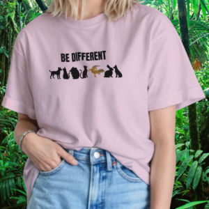 Woman wearing a light pink Be Different shirt with reptile design