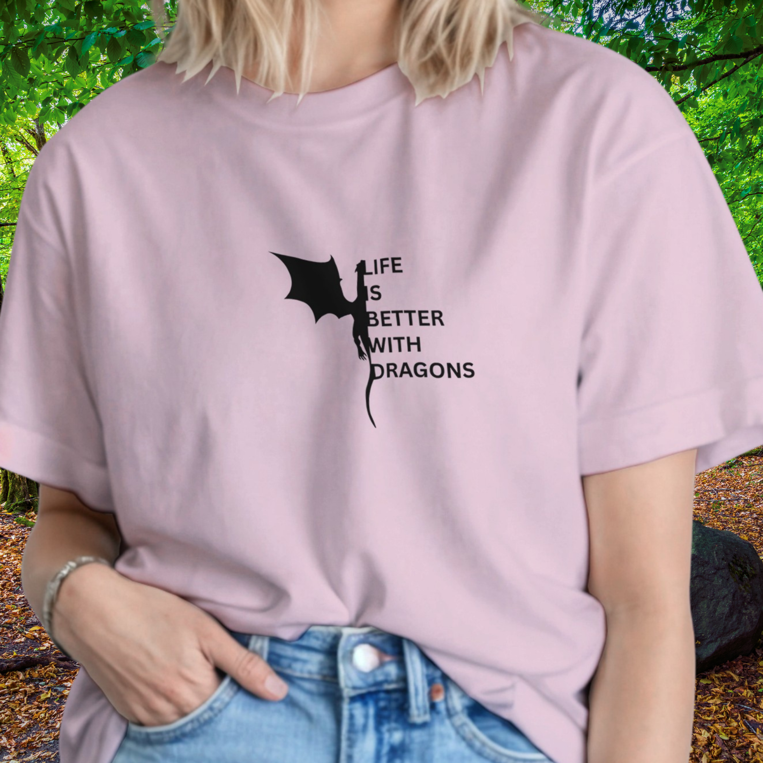 Woman wearing a light pink Dragons shirt from the Life is better Collection