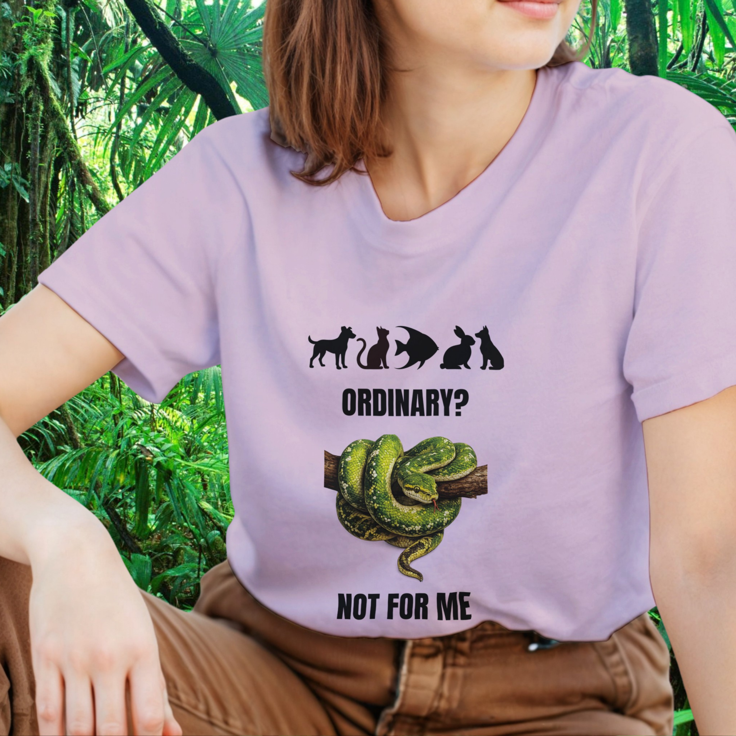 Woman wearing a light pink snake shirt from the Be different Collection