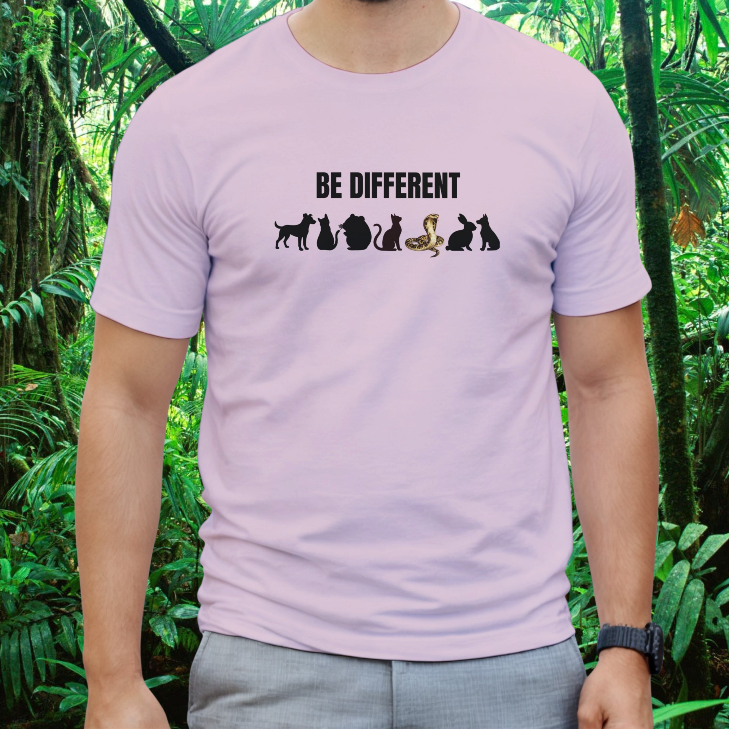Man wearing a light pink Be Different Snake shirt