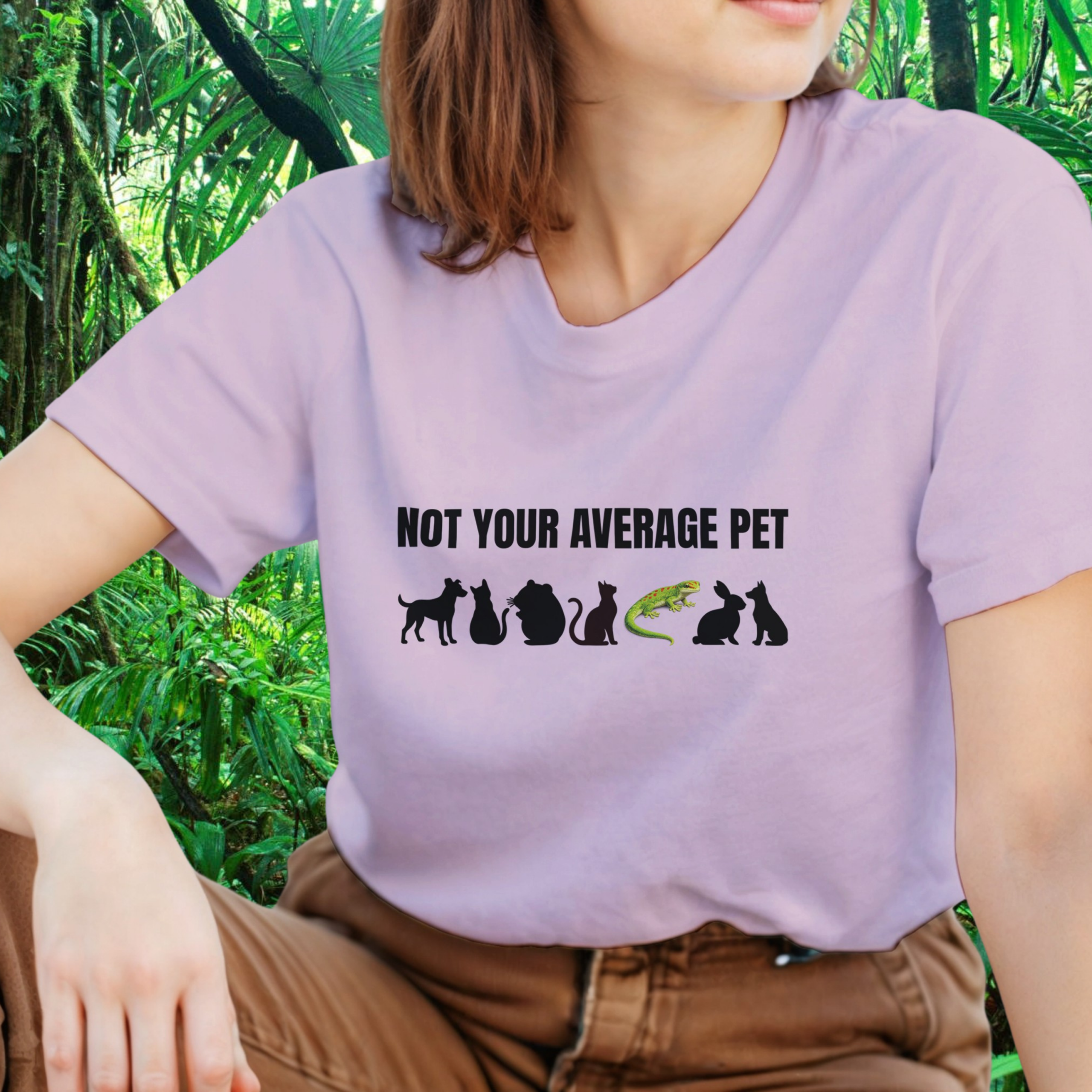 Woman wearing a light pink Not Your Average Pet Gecko shirt