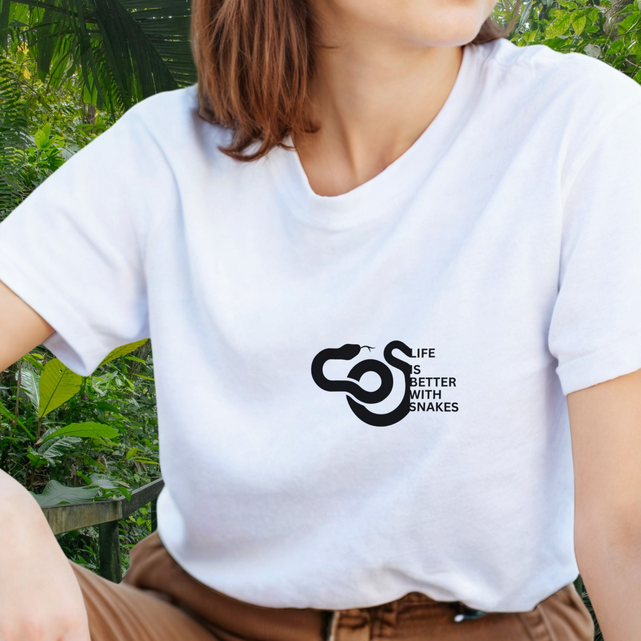 Woman wearing a white Snakes shirt from the Life is better Collection