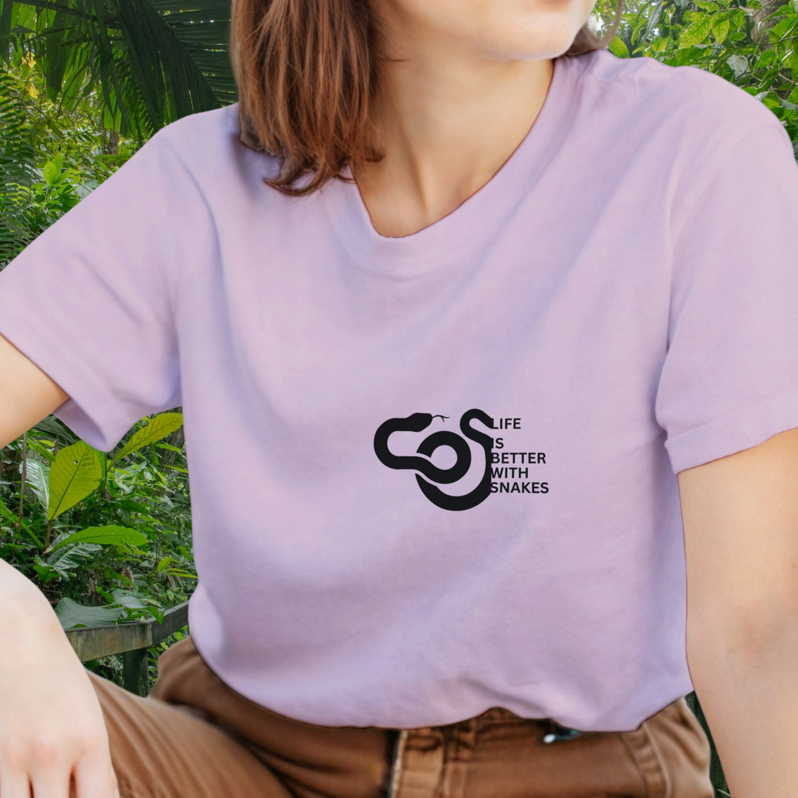 Woman wearing a light pink Snakes shirt from the Life is better Collection
