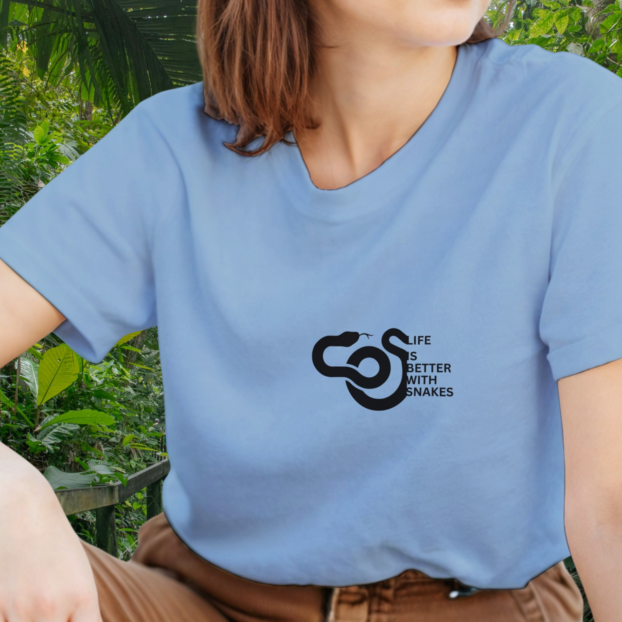 Woman wearing a light blue Snakes shirt from the Life is better Collection