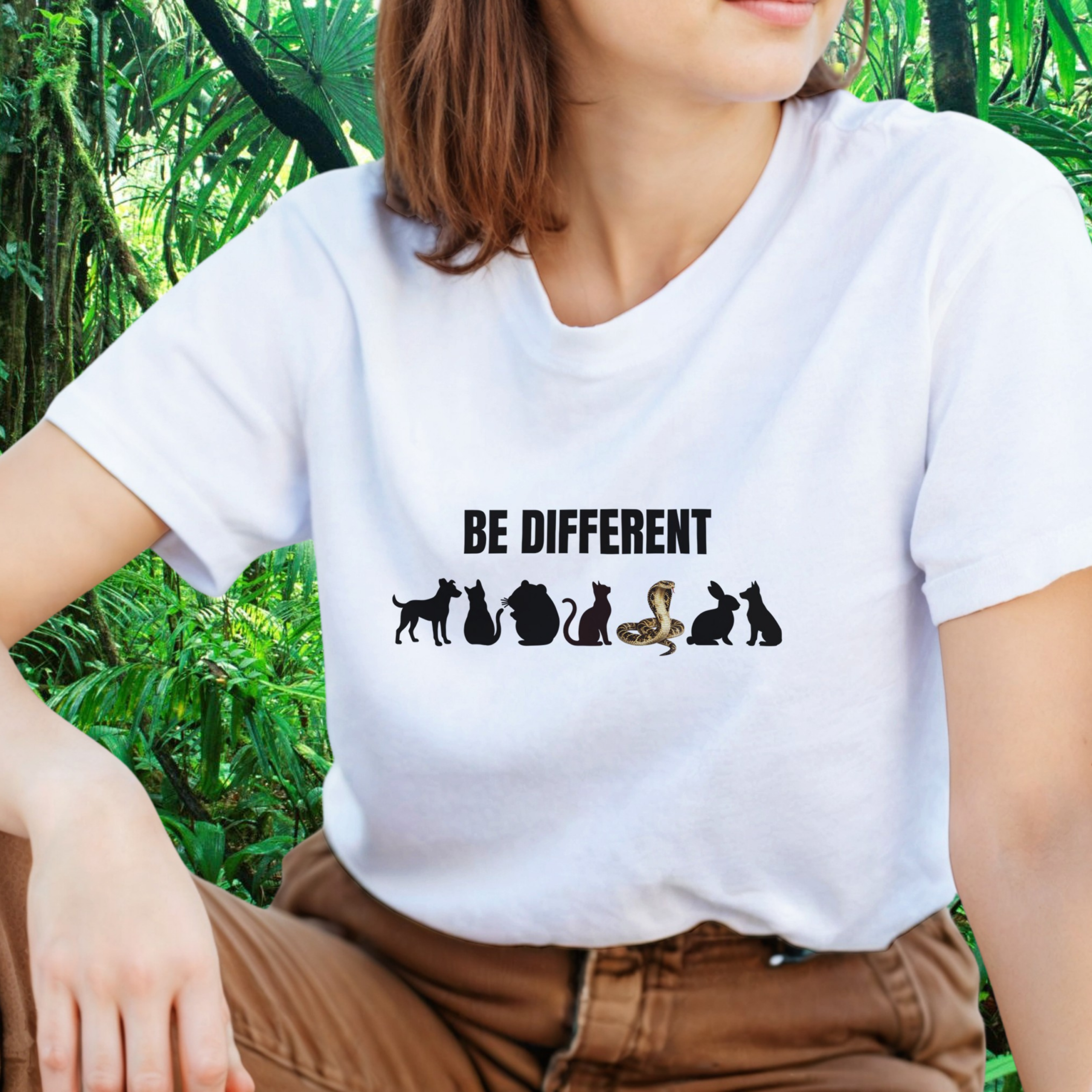 Woman wearing a white Be Different Snake shirt
