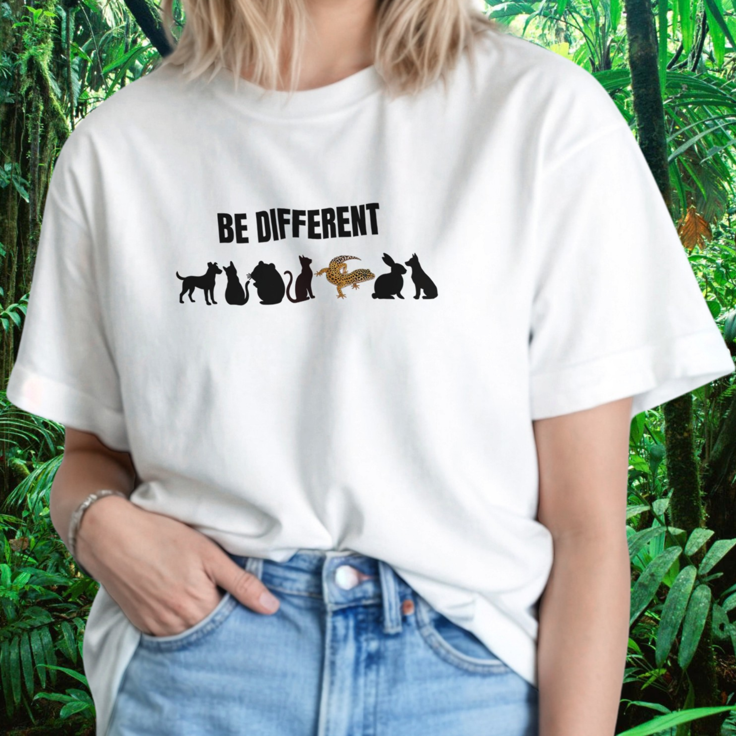 Woman wearing a white Be Different shirt with reptile design