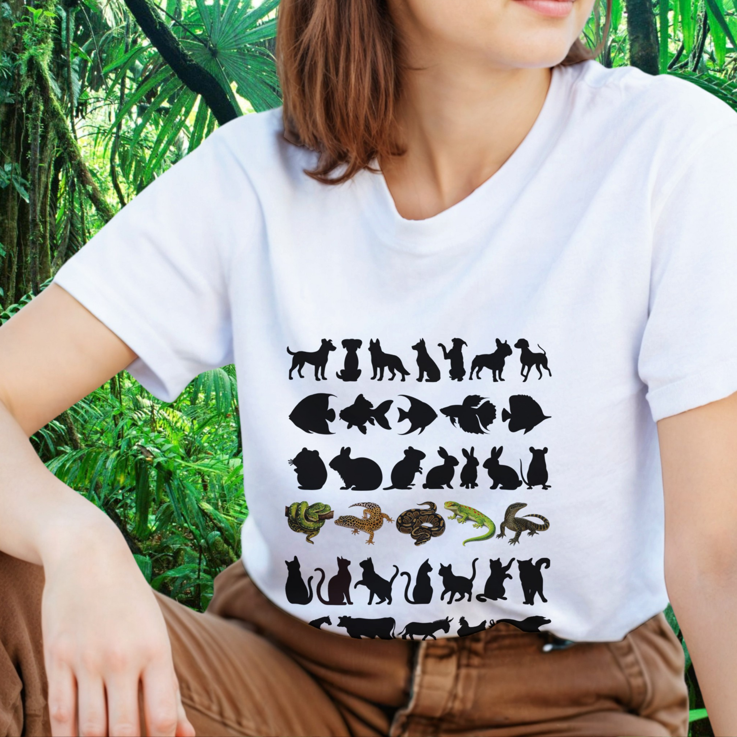 Woman wearing a white Not Your Average Pet shirt with animal silhouettes